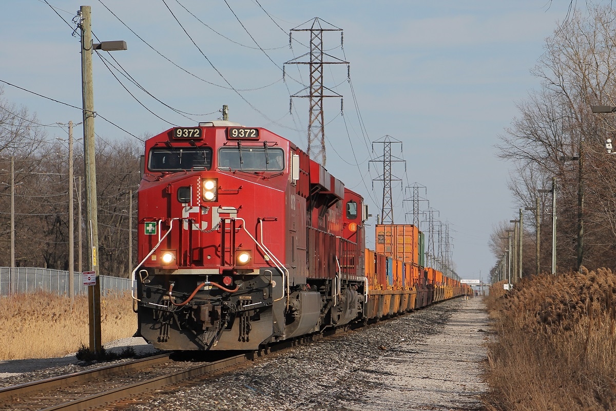 After doing work in Walkerville Yard for about 3 hours, CP 143 heads slowly west towards Lakeshore Junction in Windsor, ON. 143 is only going 10mph as they are being scanned by VACIS for customs clearance to the US.