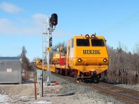 The first outing this year to Gobles Road crossing to the west of Drumbo I was surprised by the reallocation of the signals. The eastbound Herzog is on it's way to Wolverton.