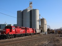 It is quite predictable these days that CP local T14 will work the large Ardent Mill facility in Streetsville on Mondays. This Monday was no exception with the train lifting four empties and dropping off only a single loaded hopper. With the retirement of the old GP9Us and the GP40s power is always a mix of GP20ECO's and GP38's, this days power was one of each. The rest of the trains consist is seen holding the north main track, while a bad order Union Pacific auto rack awaits attention on the currently unused ADM spur to the right.