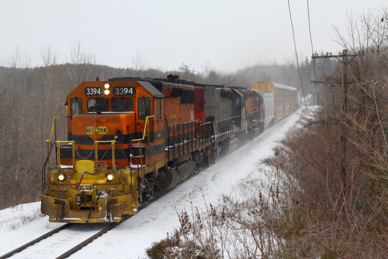 The windchill is sitting around -20 as GEXR train 431 and its 9600 horsepower tackle the Niagara Escarpment near Acton. Haze from the exhaust illustrates the how much of a battle this climb can be, and quite often the Escarpment wins, but not this day. A winter storm has once again covered the ground with snow, but will this be the last storm of the season as March rolls on.