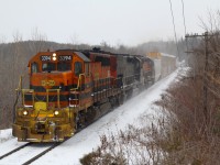The windchill is sitting around -20 as GEXR train 431 and its 9600 horsepower tackle the Niagara Escarpment near Acton. Haze from the exhaust illustrates the how much of a battle this climb can be, and quite often the Escarpment wins, but not this day. A winter storm has once again covered the ground with snow, but will this be the last storm of the season as March rolls on. 