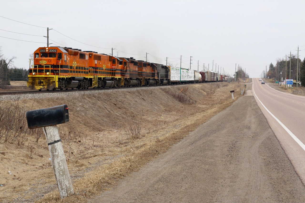 Todays GEXR train 431 apparently had more tonnage then the three usual SD's could handle, so it appears that extra power was added in the morning at Stratford. While I was hoping to catch the return trip of former GEXR GP38 #3821, now repainted and renumbered, this would be a decent replacement. The train is seen just west of Acton finally getting back up to track speed after climbing the Niagara Escarpment just east of town.