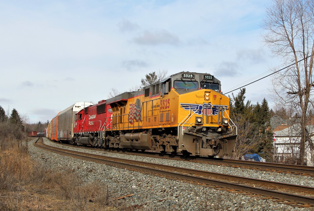 After completing its work at Guelph Junction and heading eastbound, UP 5525 leads ex-SOO SD60 6232 up to Tremaine Road at MM 34 on the Galt sub.