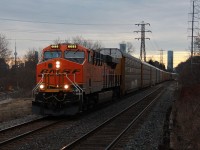 Foreign power leaders on the CP North Toronto Sub have been a relatively common thing for the last while now, however, probably 95% of that are UP leaders. BNSF leaders are rare, however, when they are seen, often 244 will fit the bill because it is typically non-stop from Wolverton so hospitality issues like hot plates or whatever CP requires that BNSF units don't have is not really a big deal for a 90 minute trip.
<br><br>
I found out about this train while waiting to get a picture of a GO train weaving down the Bala Sub at Pottery Road. A friend of mine gave me the heads that a BNSF leader was approaching Howland interlocking on the CP North Toronto Sub. Luckily for me that was a short distance up the road from where I was, however, the location I remembered as possible to choose from was more of a last resort. Within maybe three minutes of jumping out of the car it whipped around the bend. Lucky... Not knowing the potential of this vantage point, I was unaware that the CN Tower was largely unobstructed from view of this spot.
<br><br>
Alone, BNSF 6685 leads the short 15 car CP 244 through the west end of Leaside at track speed on the the way to CP's Toronto Yard in Agincourt. It took a while, but after seeing this a number of times, I finally have a photo of something other than a UP unit as foreign power leading a train in Canada. As for the GO train? Haha. Well, I was able to see it through the trees in the Don Valley on the way on the way back to my car. The anticipated L6 F59PH leader consist did not come, so in the end I guess it was a win win. Out of view beyond the road leading up to the line is the the former CP Don Branch, which if looking from this ridge would be seen clearly had the camera been pointing maybe 70 degrees to the left. There's a lot of rail infrastructure visible from this spot in the cooler months, but unfortunately both the Don Branch and Bala Subs are still heavily obstructed by trees. It's far from an ideal railfanning location sadly.
