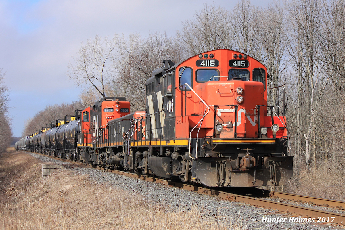 CN 4115 GP9RM leads a beltpack consist south on the St.Clair River Industrial Spur from Sarnia to Courtright in remote mode, captured here at Lasalle line. Having used this consist earlier in the week on an assignment I can say the 4100's are in much better shape than their yard unit counterparts.