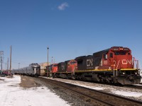 Getting underway during The Canadian's long station stop, this assortment of CN motive power is about to traverse the Ruel Sub enroute to Capreol and points south with train X114 in tow.