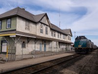 Arriving almost 90 minutes early, passengers aboard <i>The Canadian</i> were treated with an extra long stop in Melville, SK. While many dined during the second call for dinner which mostly took place while we were stopped there, others roamed the platform, decrepit yet mid-rehabilitation station, and neighbouring city streets. Adjacent was CN 192 awaiting its eastward departure.