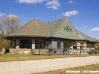 The old Pere Marquette station in Kingsville, one time almost met it's maker by way of the wrecking ball. However, someone, somewhere saw what every rail fan would see - the history, and it was saved despite the removal of a few tiles of slate from it's roof line. 
<br>
<br>
Now restored both inside and out, as well as the surroundings (used to be all industiral - all have gone and replaced by residential dwellings)...it is definitely an eye catcher along the Chrysler Greenway Trail. The station is now home to Mettawa's, a great little restaurant and well worth the visit. 
<br>
<br>
PS - any of you veteran photographers out there want to Time Machine this gem? I'd love to see this happen with someone posting the same angle, but with the station still in service.