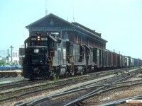 LS-3 heads west from the CASO Station in St Thomas July 1976. Soon Penn Central Brunwick Green will be replaced by Conrail Blue.