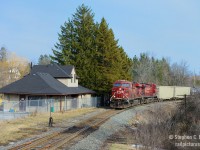 Hidden in plain sight -  here's one for the  Station guys,a photo that took some planning and time to execute. When I Saw Arnold Mooney's photo of <a href=http://www.railpictures.ca/?attachment_id=24622 target=_blank> Waterdown North in 1980 </a> I looked on the map and saw a structure close to the tracks.. could it be? Yes... it is! Waterdown North still stands to this day, used as offices for Compass Minerals. You can't see it from the road, it's blocked entirely by trees. And sun angles require a Northbound at the right time of day.<br>For more info on Waterdown North, visit the Old Time Trains entry <a href=http://www.trainweb.org/oldtimetrains/CPR_London/stns/waterdown.htm target=_blank> http://www.trainweb.org/oldtimetrains/CPR_London/stns/waterdown.htm</a>. This is the only station from the Southern Ontario Pacific extension of the CPR Hamilton to Guelph Jct line remaining of course, and one of Four stations remaining on the Hamilton sub.  (which are Waterdown North (CP), Hamilton Hunter St (TH&b), Smithville (TH&B), Welland (PC/CR/TH&B) - Honourable Mention is Aberdeen which was once part of the TH&B Welland sub.)
