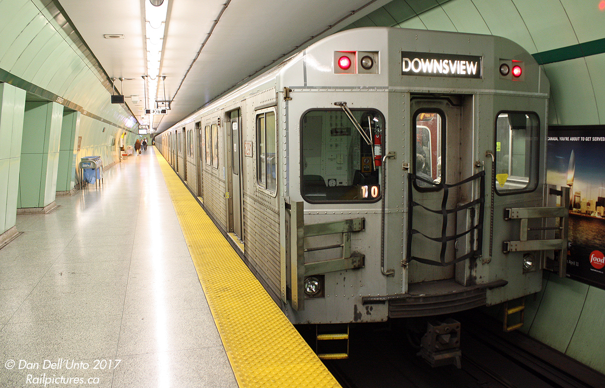 TTC T1 5291 trails a 6-pack of Bombardier T1's heading south on the University Subway line, paused at the very mint green St. Patrick Subway Station, its decor a product of the early 1960's and still sporting its original green circular metal tiling.