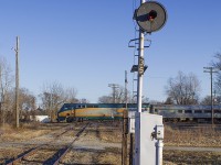 Train 78 led by engine 902...with an all stainless steel consist cross the diamond with the now, mostly abandoned CSX line. Rather forlorn, it shows, especially with the extended daylight. 
