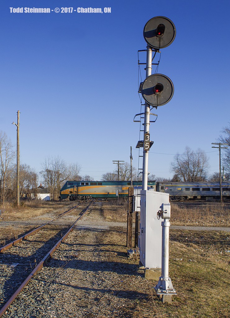 Train 78 led by engine 902...with an all stainless steel consist cross the diamond with the now, mostly abandoned CSX line. Rather forlorn, it shows, especially with the extended daylight.