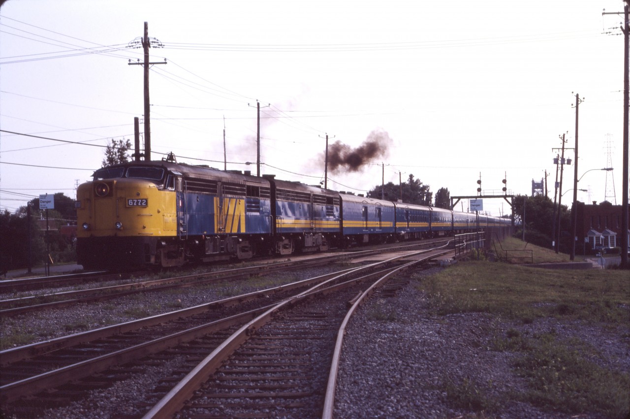 Here we are once again in St. Lambert on a summer's evening in 1987. VIA's F40PH-2 units are starting to be used on transcontinental trains, so it's a treat to get a matched set of FPA4/FPB4 units. The engineman has just cracked the throttle to pull away from the station--in your mind you hear Stan Roger's singing "the Ocean's going to take me home..." and revel in the sound of a matched set of 251 Alco prime movers as the train leaves town!