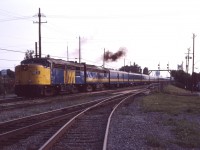 Here we are once again in St. Lambert on a summer's evening in 1987. VIA's F40PH-2 units are starting to be used on transcontinental trains, so it's a treat to get a matched set of FPA4/FPB4 units. The engineman has just cracked the throttle to pull away from the station--in your mind you hear Stan Roger's singing "the Ocean's going to take me home..." and revel in the sound of a matched set of 251 Alco prime movers as the train leaves town!
