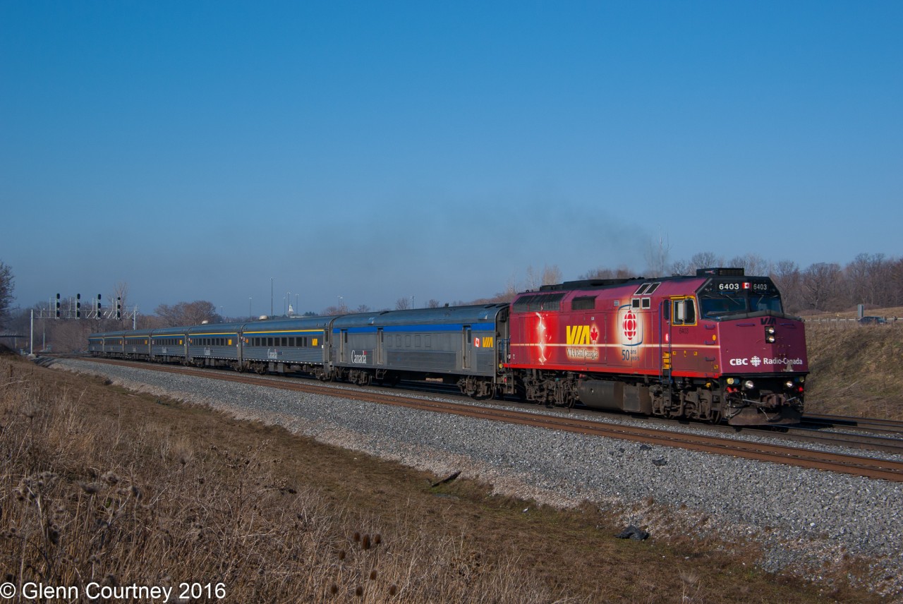 Via 6403 in its CBC 50th Anniversary wrap leads a seven car #70 through Snake.