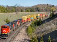 A trio of Dash 8 gracefully bring 149's train up the hill through Beare 

CN 2116, CN 2166, CN 2150