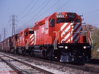  After arriving in town the previous night from London under the cover of darkness, brand-new shiny right out of the box CP SD40-2's 5953-5952 along with an unidentified M-636 stretch their legs as the blast No 904 through the Powell Sidings and out of Windsor into the flatlands of Essex County.  This was the regular routine for new power out of GMDD.  Presumably, if there was a problem, the GMDD rep could meet the train back in London. At the time 904 was the hottest train on the Windsor Sub, handling autoparts for Oakville, Oshawa and St Therese. 