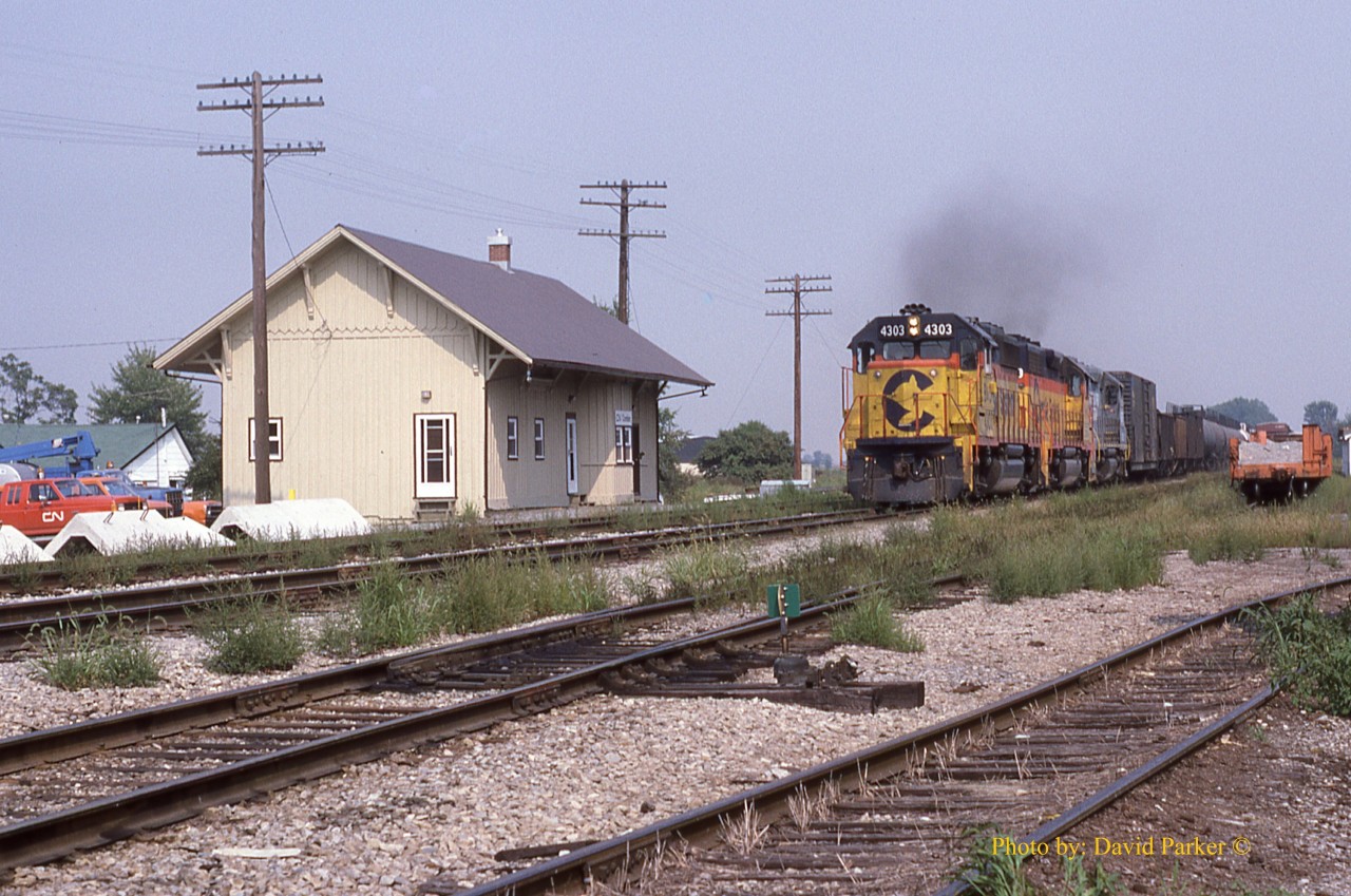 CSXT #321 hustles past the Ex NYC Depot at Comber, Ontario on the CN Caso Sub.