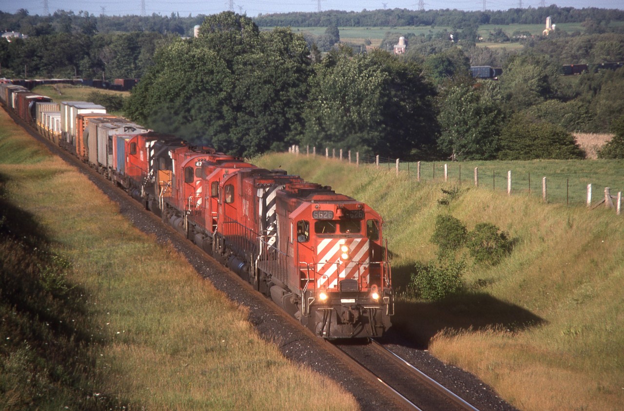 Late afternoon sun lights up the North side of a typically powered CP 903 at Newtonville, Ont.