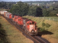 Late afternoon sun lights up the North side of a typically powered CP 903 at Newtonville, Ont.  