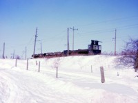 [Editors note: First photos of this rare operation on rp.ca]  another image of the unique trains on Canada Cut & Crushed Stone. Image taken on Harvest Road east of Greensville Ontario. It was a cold winter afternoon for pictures with my Kodak Instamatic.