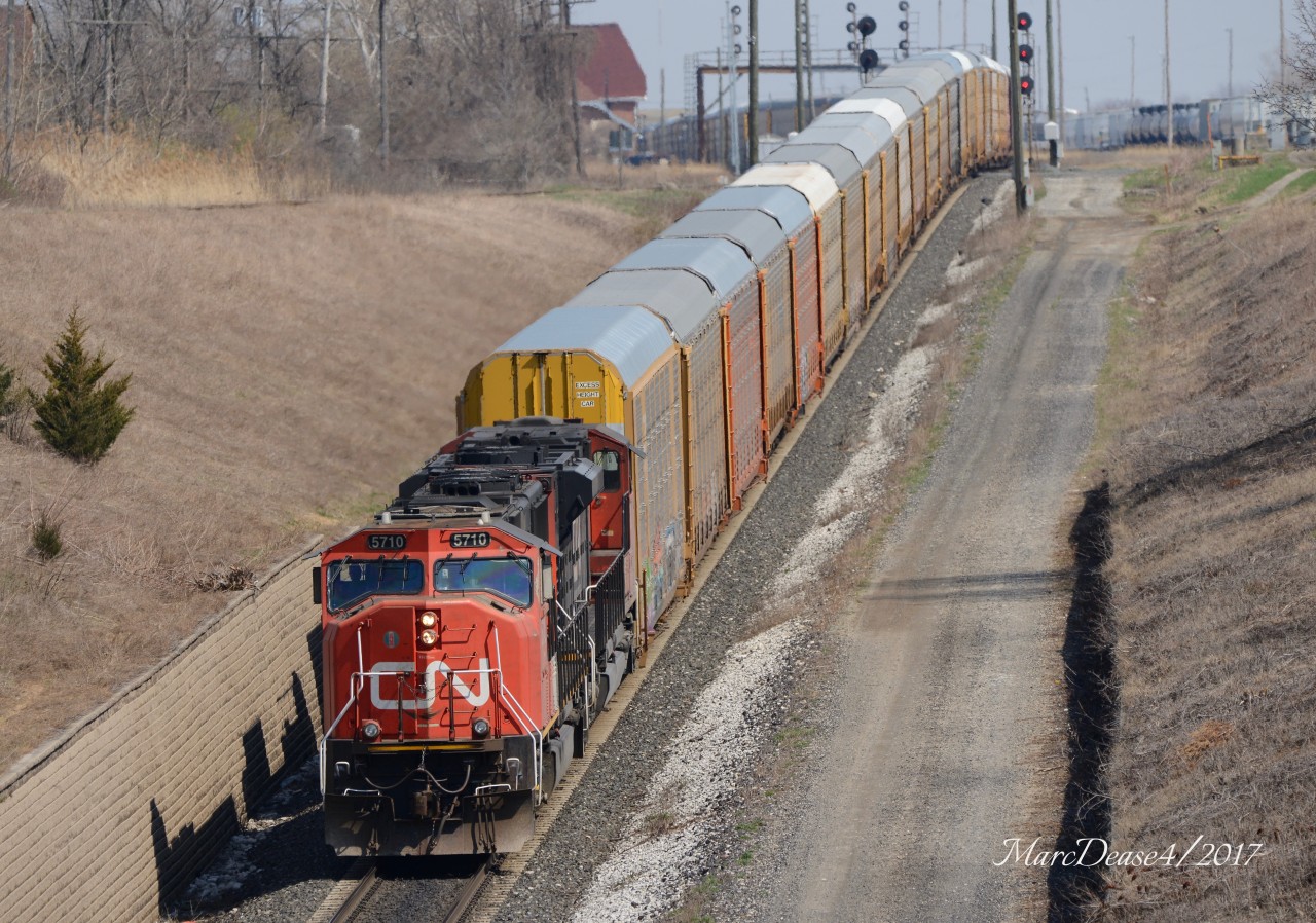 CN 5710 with CN 8820 leading train 371 out of Sarnia to Port Huron, MI., via the the Paul M. Tellier under the St. Clair River.
