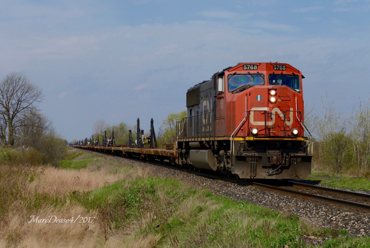 CN 5768 leads train X312 east out of Sarnia at Fairweather Road.