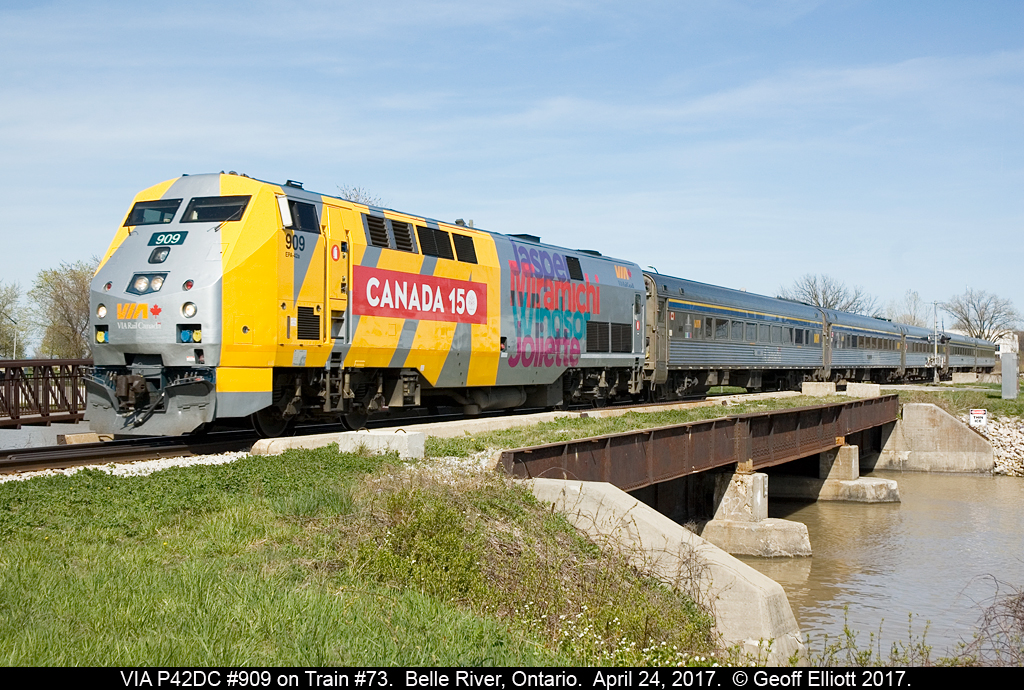 VIA #909, in a fresh Canada 150 wrap, leads train 73 across the Belle River bridge in Belle River, Ontario on April 24, 2017.