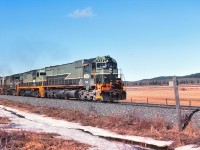 The slide is dated April 1981, although I wondering if the image was taken late March. Difficult to see in the image but the lead locomotive 714 is displaying "green flags & green class lights" indicating a following section of the same time table scheduled train, most likely this would be "First 36".  Note the large fields in view, this was a large specialty hay ranch that produced a top quality feed hay that was exported to numerous ranches and tracks for racing horses.