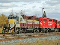 GP38-2 CP 3084 in Tuscan & Grey heritage colours and sister 3126 wait for an assignment at CP's Scotford Yard.