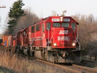 Coming back from Paris, I had heard this westbound CP train closing in on Ayr so I knew I wouldn’t have much time to set-up. Sure enough, just as I reached Reidsville Road, I had about five seconds to grab the camera and click this shot of two SOO SD60’s and a CP SD40-2 as they waste no time heading towards London in the fading light of a gorgeous spring day. 
