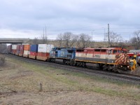 CN Q14891 11 leaning into the curve at Garden Ave with BCOL 4616, and IC 2459, and 148 cars