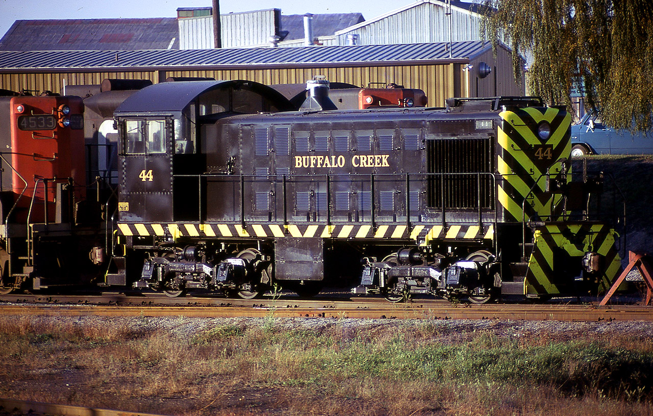 Telephoto image of Buffalo Creek S-2 #44 (built 1947)sitting in the old Niagara Falls yard for whatever reason.
The unit looks freshly painted. In less than a year BCK would be one of the small shortlines swallowed up in the formation of Conrail. This unit was assigned number CR 9661. In background, situated on Victoria Av,  is the top of the old Provincial Steel building, which once had rail connection with CN.