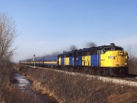 Knowing that VIA trains 72 and 74 had older power, and not the dreaded, new F40's, I went trackside from the house on a beautiful Tuesday morning in early March. In Canada's ' Sun Parlor ' you can expect this type of weather at this time of the year. With 8 coaches and a full baggage car behind them, FPA-4's 6782-6793 bring train 72 across the CPR Windsor Subdivision, just a few minutes from their scheduled station stop. Even on a Tuesday in March, this early morning run warrants a big consist. It was probably well-filled going west the night before as train 77. 6782 went for scrap, but 6793 was initially operated as Western Maryland Scenic RR " B&O 893" before ending up on the Grand Canyon Rly, renumbered to 6793 again. It may or may not be in service.