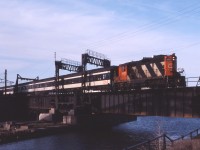 When the Montreal Urban Community took over operation of CN and CP's West Island commuter trains in 1982, CN's South Shore commuter train was not included. CN continued to run the train until September 9, 1988 when the service was discontinued. Compare this spring 1986 shot with Michael Berry's image 29003 (taken from opposite sides of the Lachine Canal).