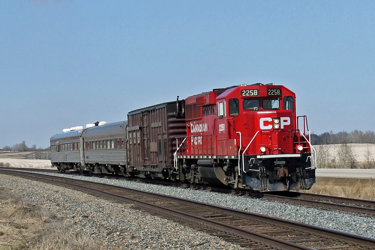CP's track test train seen on the relatively new Netook siding between Bowden and Olds.  Led by GP20C-ECO 2258 the train comprises Box car 424994 tool/generator car, coach #65 accommodation car (ex Amtark Budd car) and track evaluation car #64 (ex Amtrak Pullman Standard car)