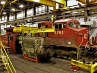 8793 a GE ES44AC is in for an engine overhaul. New 12 cylinder single turbocharger 4400 horsepower engine is set up on the lifter and ready to go. 