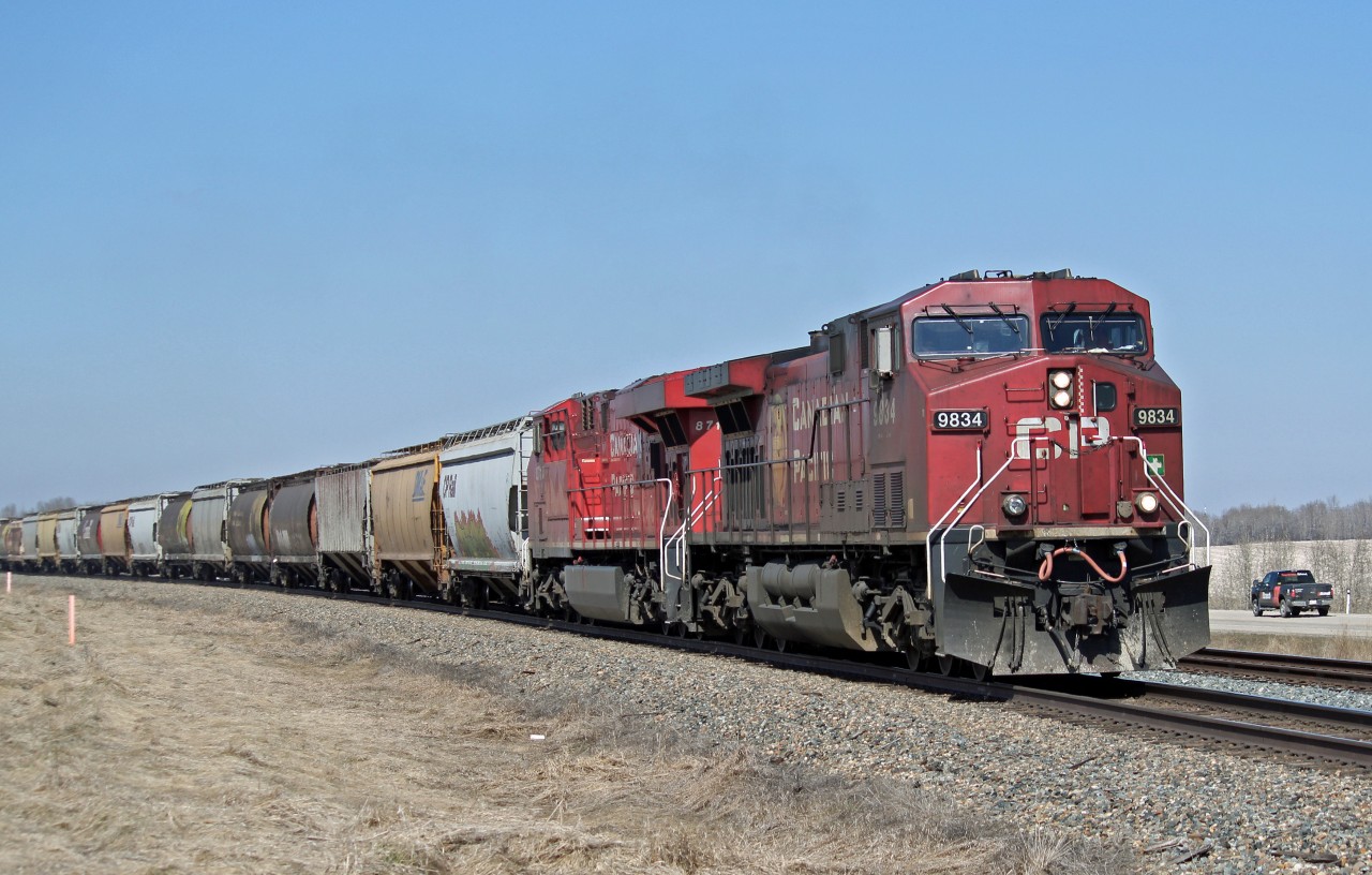 AC4400CW CP 9834 and ES44AC CP 8713 lead a train of hoppers south at Netook.