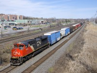A very lage CN 377 (179 cars) is passing MP 14 of CN's Kingston Sub with a single SD70M-2 up front and another one mid-train (CN 8880 & CN 8916).