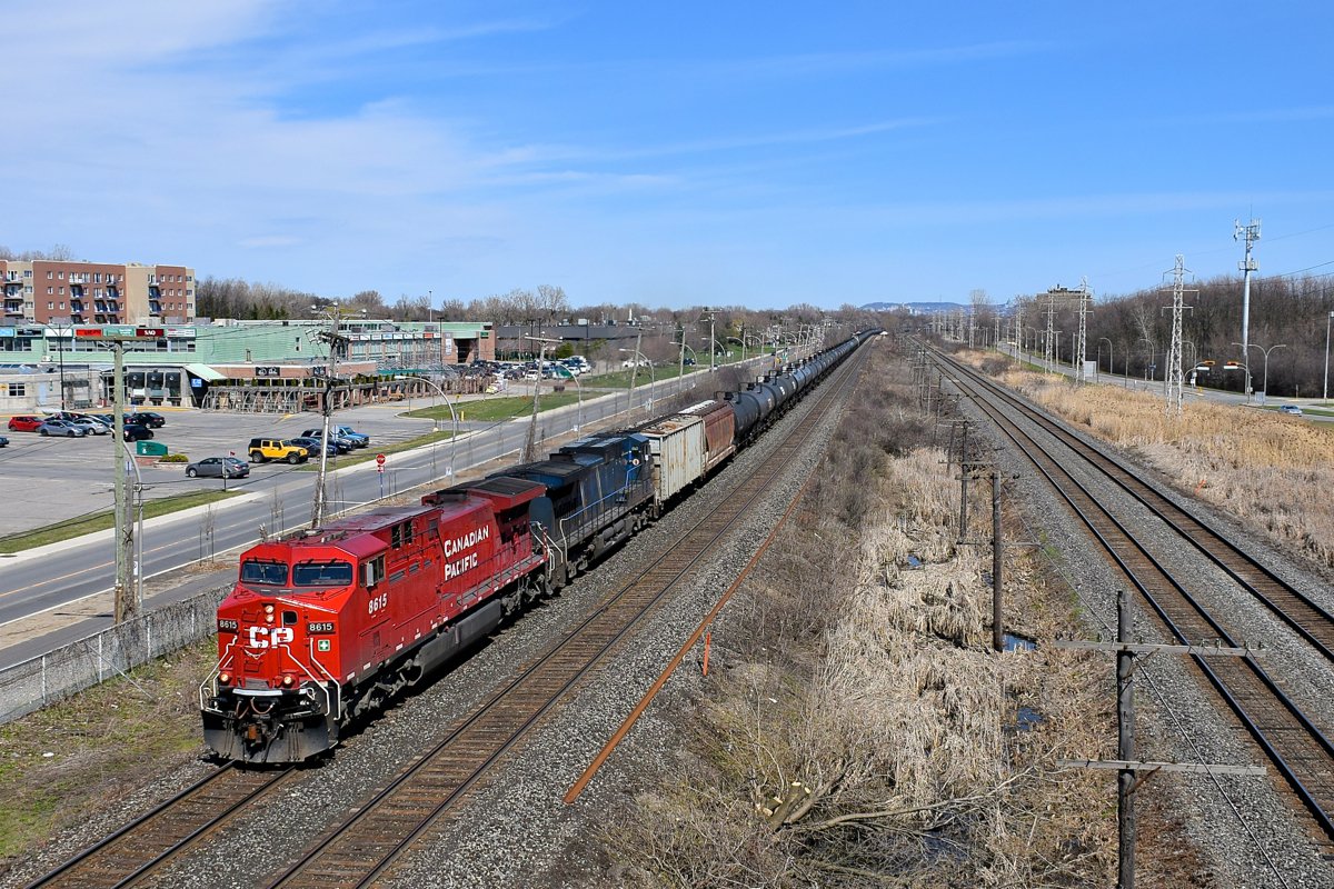AC440CW CP 8615 looks pretty fresh (especially compared to most of CP's grungy looking AC4400CW fleet) as it leads empty ethanol train CP 651 through Pointe-Claire. Trailing is CEFX 1039.