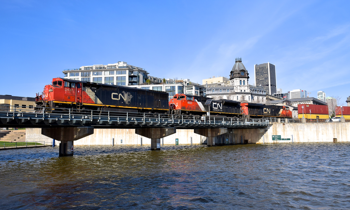 After a record amount of rainfall in April, the water level of the Lachine Canal and the St. Lawrence River is among the highest its ever been. Here CN 149 is seen crossing the eastern end of the Lachine Canal just before 9:00 this morning with CN 2437, CN 8923 & CN 2226 for power.