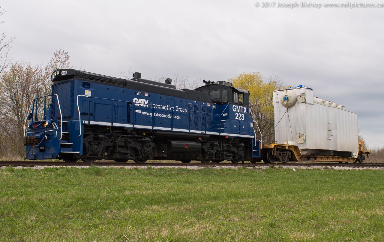 GMTX 223 sits coupled to a dimensional load from Trenergy Plant in St. Catharines Ontario.  The 223 is the latest face of the Trillium Railway as they begin to turn to a more reliable motive power source over their ailing ALCOs.  223 will be returning to the GMTX with a new unit, GMTX 333 now on the Trillium property.