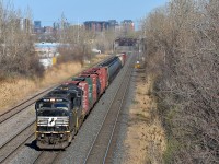 Ex-Conrail SD60M NS 6765 (originally CR 5504) leads NS 8149 on CN 529, approaching Taschereau Yard with only 32 cars.