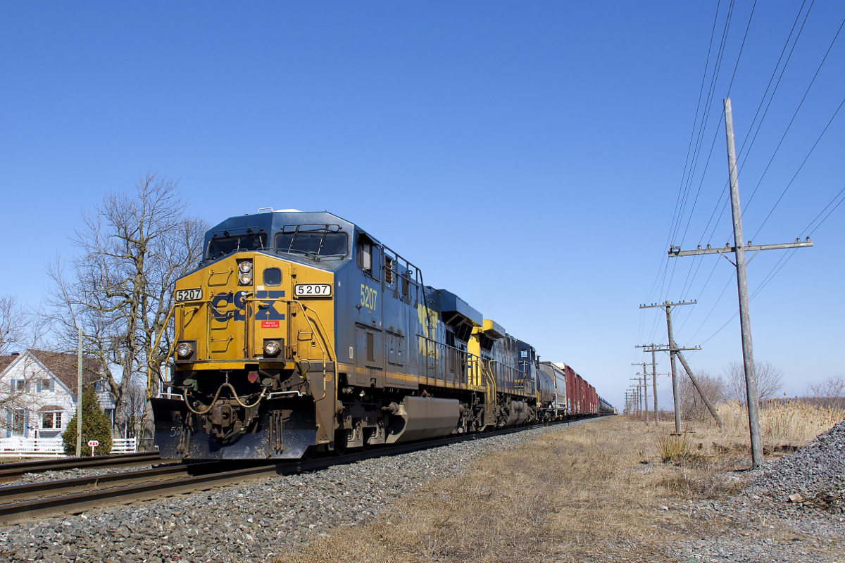 CSXT 5207 & CSXT 416 lead a 78-car CN 327 through Coteau-du-Lac on a gorgeous and warm afternoon. Up next is a set-off at Coteau and then heading south for interchange with CSX before a CSX crew takes it across the border.
