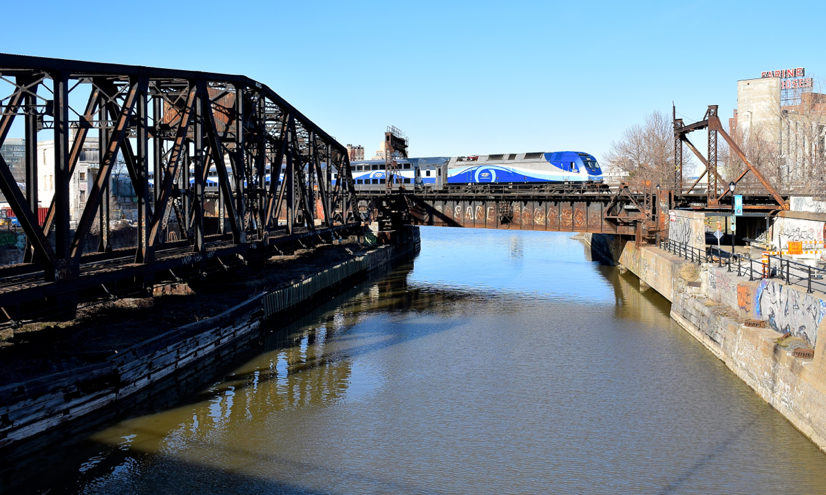 AMT 1359 leads AMT 816 over the Lachine Canal, whose waters levels are quite high with spring runoff.