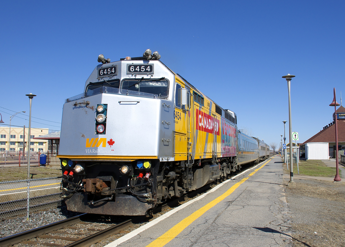 VIA 635 has one of two VIA Rail F40's which are wrapped in a Canada 150 scheme as it leaves Dorval Station for Ottawa on a warm and sunny afternoon.