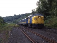 
Train 76 with an abbreviated consist, gliding past the old crossovers and 'switchback' leading to Steetley Canada, an eighth of a mile east of the former station. The classy FPA4 looks barren on the nose, not having a logo or a set of ditchlights. Another example of being in MooneyLand but not crossing paths.