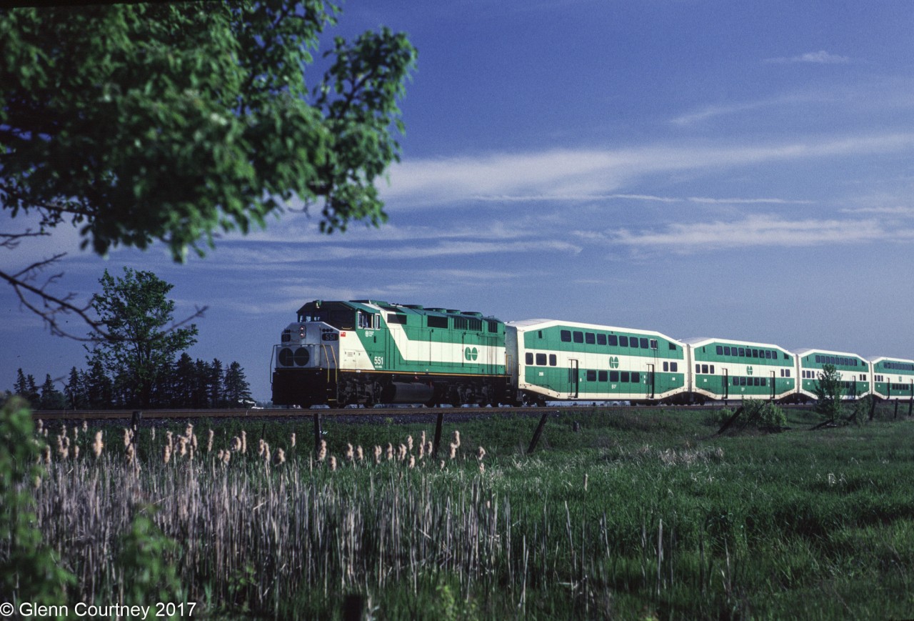 GO 551 heads back to Toronto with a Blue Jays special after pushing a rush hour train out to Milton.