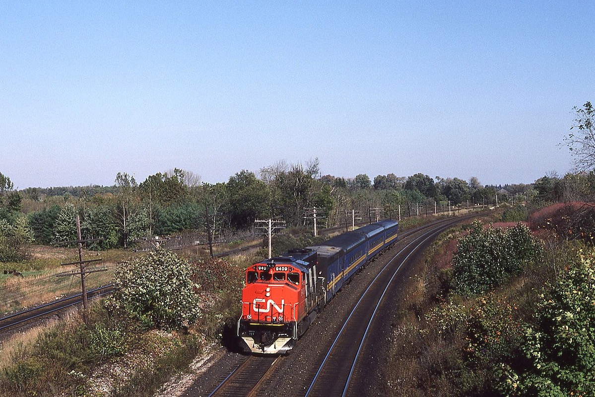 Hyde Park/Denfield Road - most of us know this location.
I had the wife drop me off while she ran some errands and I was rewarded with a hastily borrowed GP40-2W on VIA's Windsor train 73 this day. The steam generator car is keeping the travellers comfortable on the early fall morning. Obviously something was amiss with older covered wagons that day but looking back, I'm not complaining now !